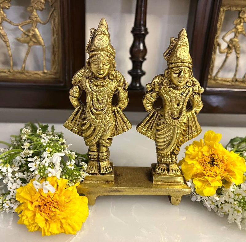 This 4.5 inches Lord Vitthal Rukmini brass idol is a stunning piece of home decor that carries deep spiritual significance