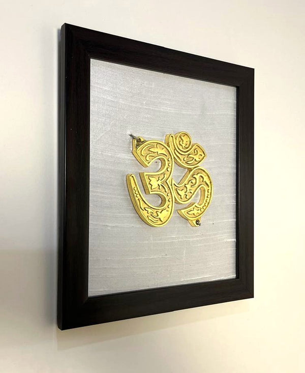 Aum Auspicious Symbol Pure Raw Silk Brass Wall Décor I Spiritual Symbol Wall Décor I Om Brass Accent on White silk backdrop I Brass & Silk Subh Chinha Wall Frame