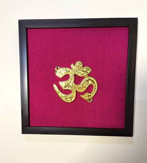 Aum Auspicious Symbol Wall Décor I Spiritual Symbol Wall Décor I Om Brass Accent on Magenta silk backdrop I Brass & Silk Shubh Chinha Wall Frame