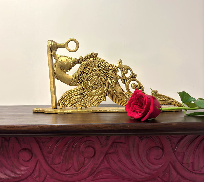 Brass, a revered metal in Hindu culture, is believed to possess inherent purifying properties, making it an ideal material for sacred objects