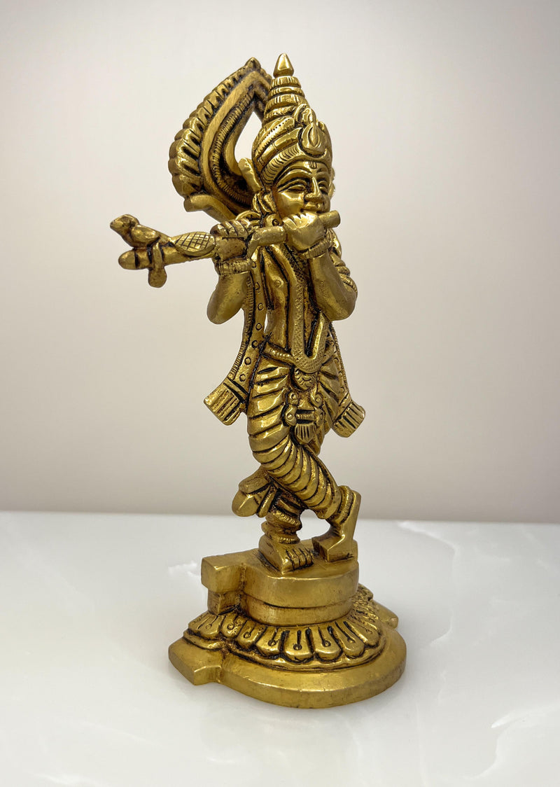 This exquisite small sculpture of Lord Krishna is handcrafted by skilled artisans in India