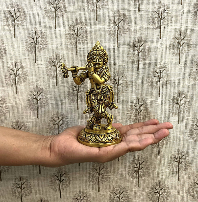 This exquisite small sculpture of Lord Krishna is handcrafted by skilled artisans in India