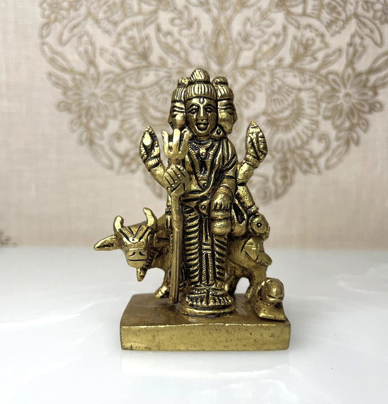 This 3.5-inch exquisitely carved statue of Lord Dattatreya in fine brass represents the divine Hindu trinity of Brahma,
