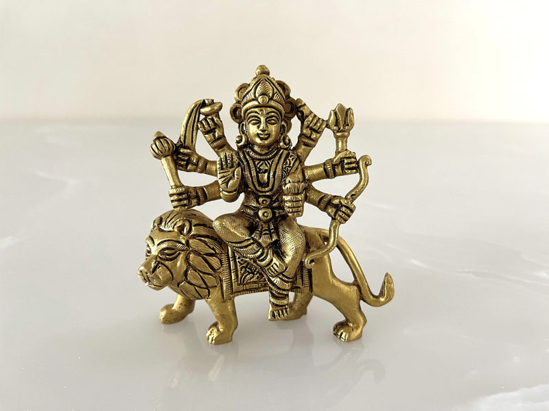 This magnificent 4.5-inch Durga Maa statue, crafted from pure Brass, is a representation of the Goddess of power, protection, and victory