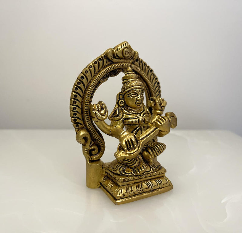 Crafted with precision in pure brass, this statue depicts the Goddess in a posture of serene grace radiating tranquillity and inspiration