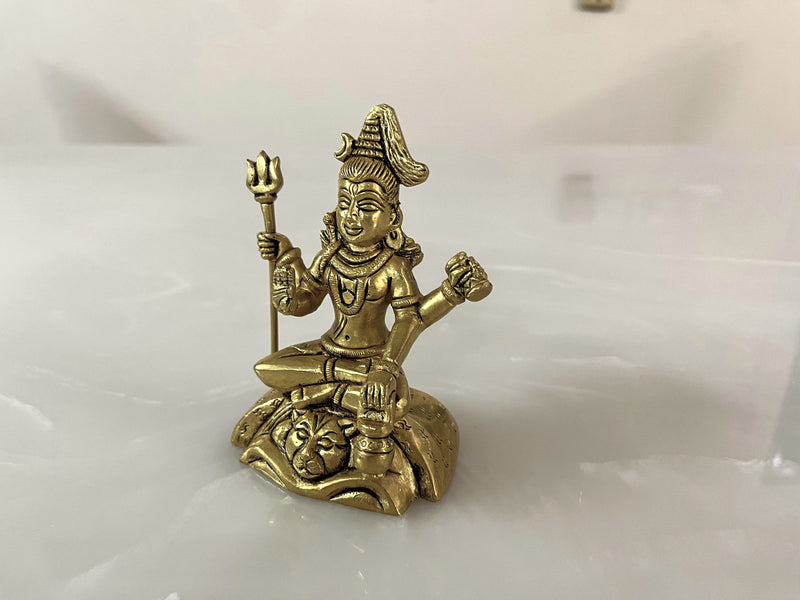 Lord shiva the supreme deity known as Mahadev is sitting in Abhaya Mudra, adorned with a snake symbolising fearlessness