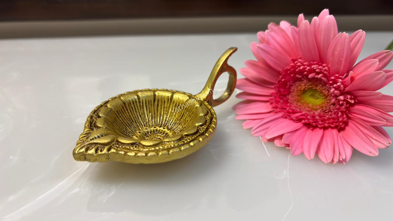 Lighting a brass Diya: A Daily Ritual in India
