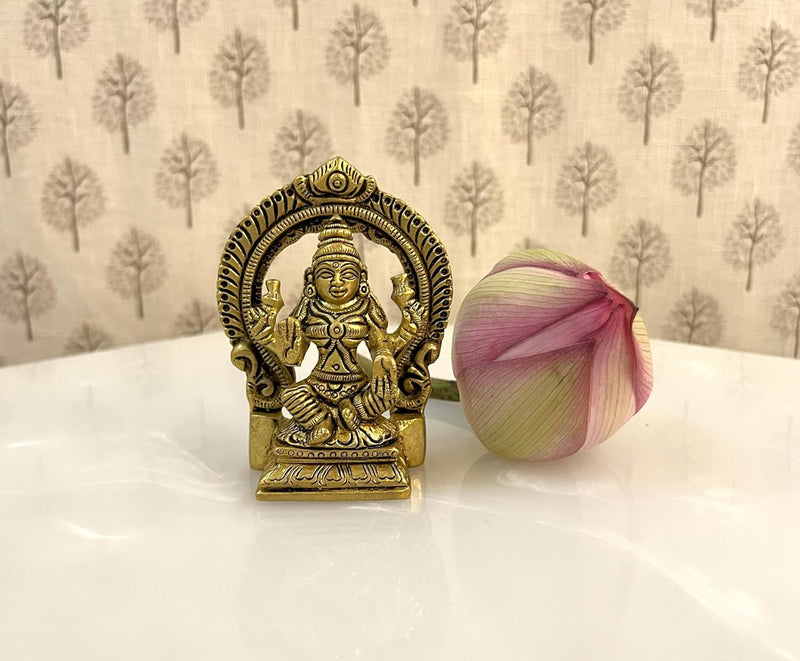 This exquisitely engraved 3.5 inch Brass statue of Goddess Lakshmi & Ganesh ji