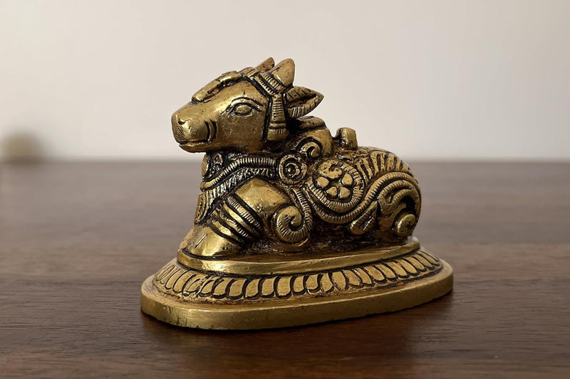 This small yet magnificent Nandi statue having a Golden Yellow Antique finish is meticulously crafted from high quality brass.