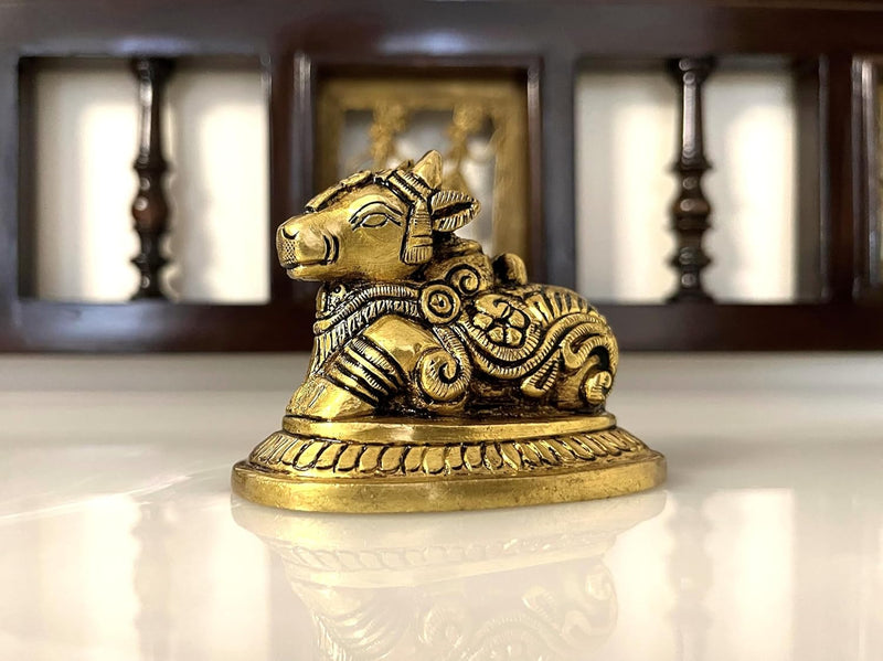 This holy brass statue of Lord Nandi, the Vahan of Lord Shiva